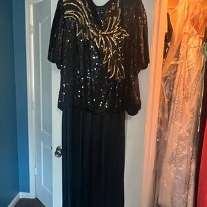 Black and Gold Sequin Top over black dress. Great for parties!